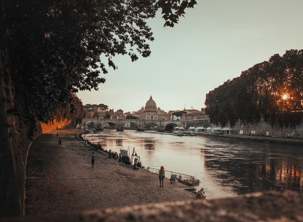 Photograph of a river in Rome at sunset

